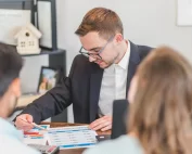 mortgage broker in conversation with couple