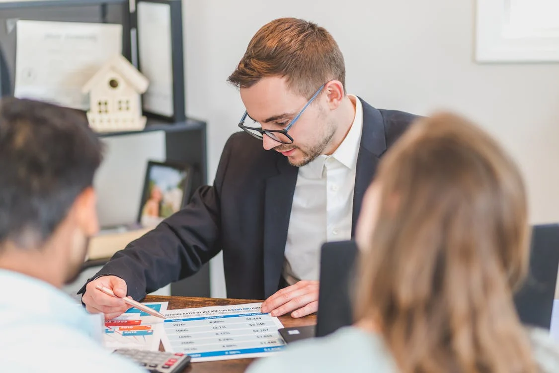 mortgage broker in conversation with couple