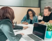 couple reviewing paperwork with consultant