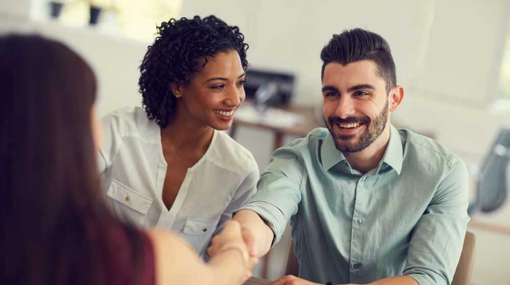 man woman hand shaking